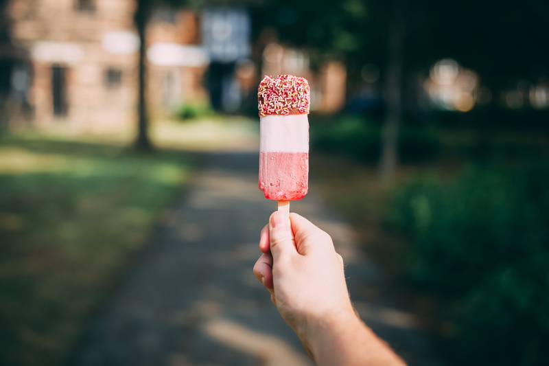 stick - Plant Part, solero, hand, snack, waffle, close-up, outdoors, gourmet, flavored Ice, hold, food, white, sweet Food, people, candy, refreshment, ice pop