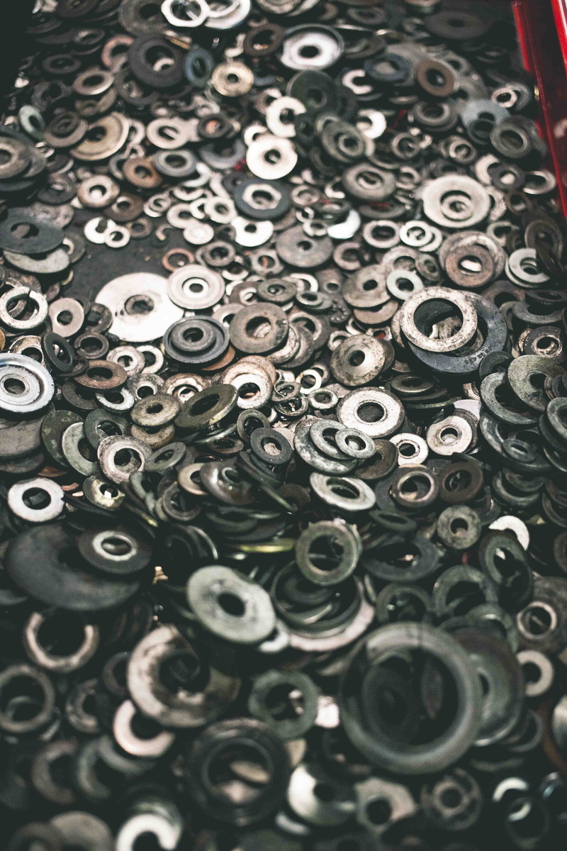 grease, wheel, collection, abundance, floral pattern, indoors, washers, high angle view, pattern, eyelet, still life, lot, oil, industry, motorcycle