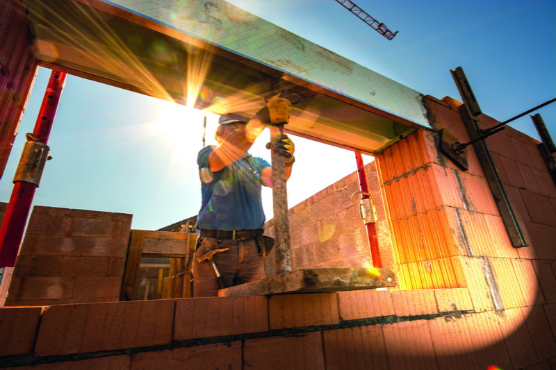 low angle view, sunbeam, craft, sunlight, one person, building exterior, site, roller shutter box, men, construction company, nature, construction industry