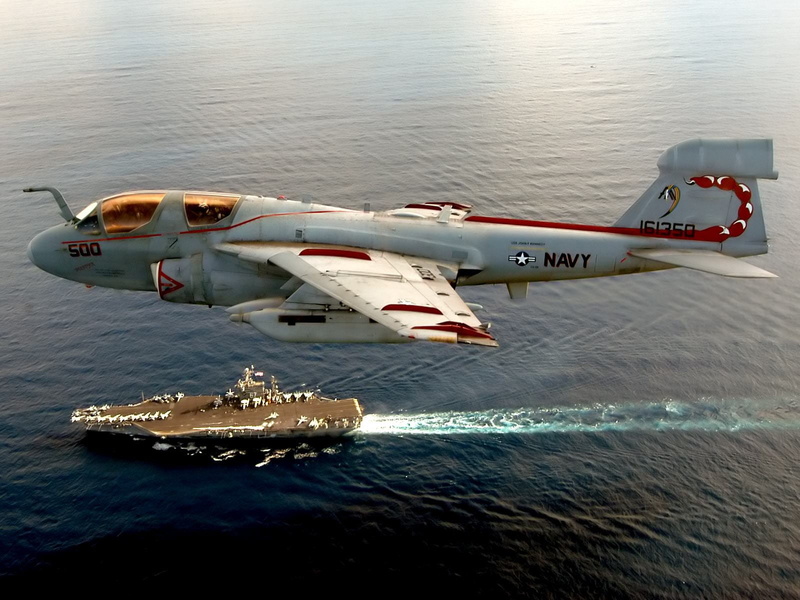 flying, freight transportation, government, rescue, high angle view, ocean, navy, outdoors, aerospace industry, air vehicle, red, sea, day, business, carrier