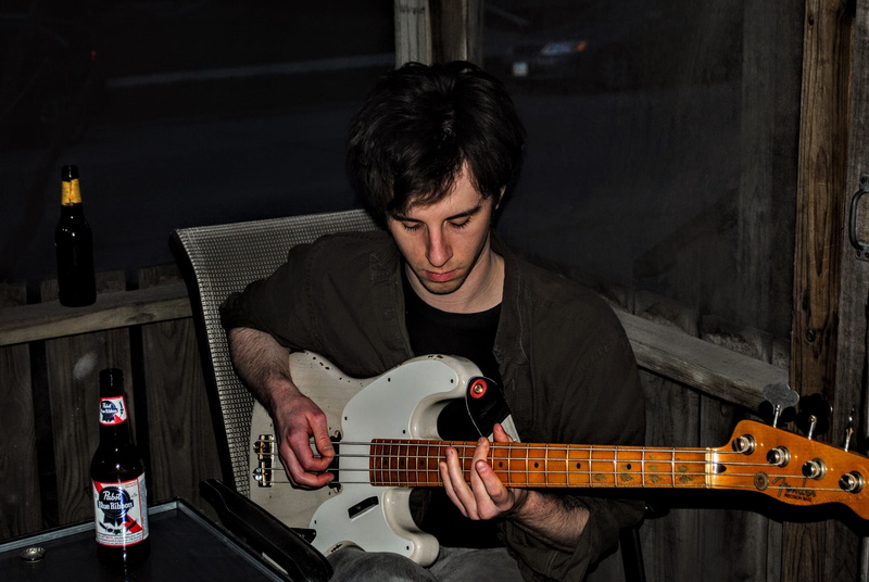 band, sitting, person, indoors, waist up, leisure activity, young adult, electric guitar, instrument, guitar, real people, man, musician, casual clothing