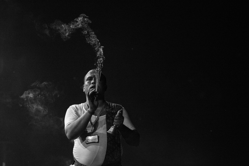 black-and-white, adult, hinduism, serenity, black and white, holding, men, young adult, smoke trail, young men, waist up, standing, studio shot, activity