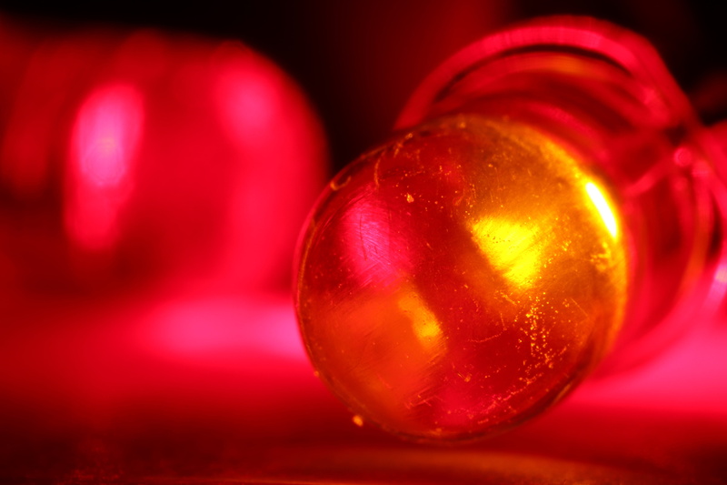 electric light, darkness, single object, macro, red light, focus on foreground, led lamp, red, lighting, still life, diodes, studio shot, 5K, led lighting