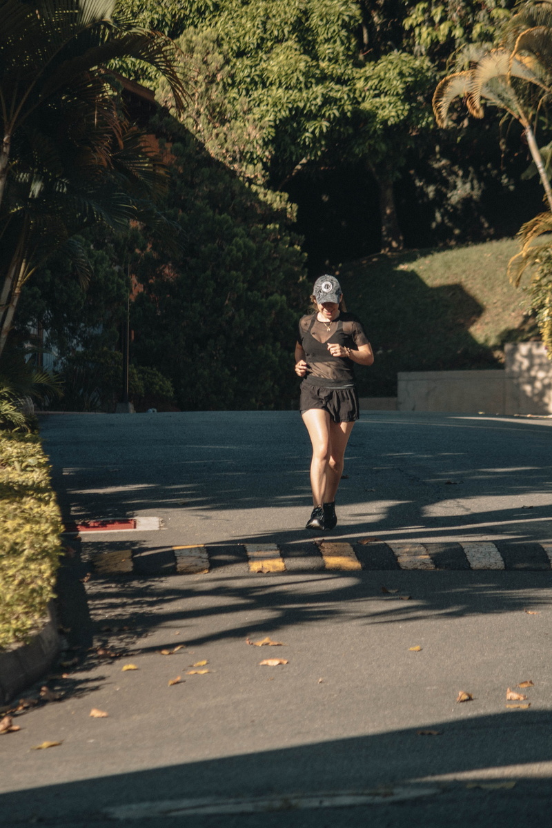 helmet, shorts, 5K, gym, exercise, slope, working out, human, real people, casual clothing, walking, one person, plant, park, sports, shadow, full length