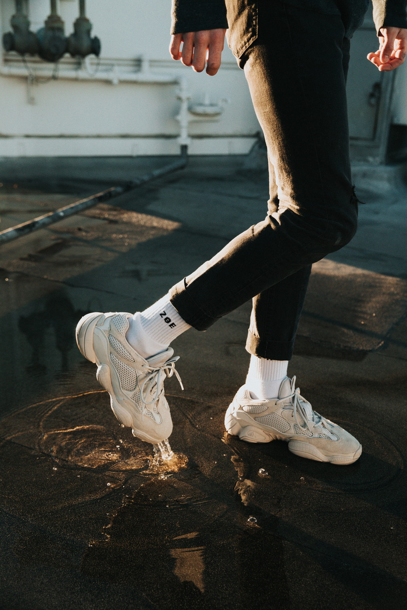 standing, skin, one person, footwear, pants, real people, human, black, lace, walkway, knee, body part, shoes, skill, ballet, undershirt, white, bird, person