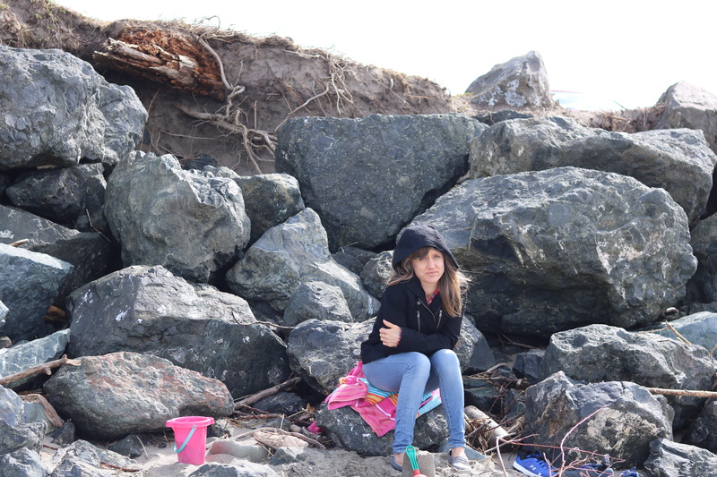 rock, real people, slate, full length, solid, shoe, human, wood, nature, beautiful woman, lifestyles, day, shorts, person, rubble, footwear, flagstone