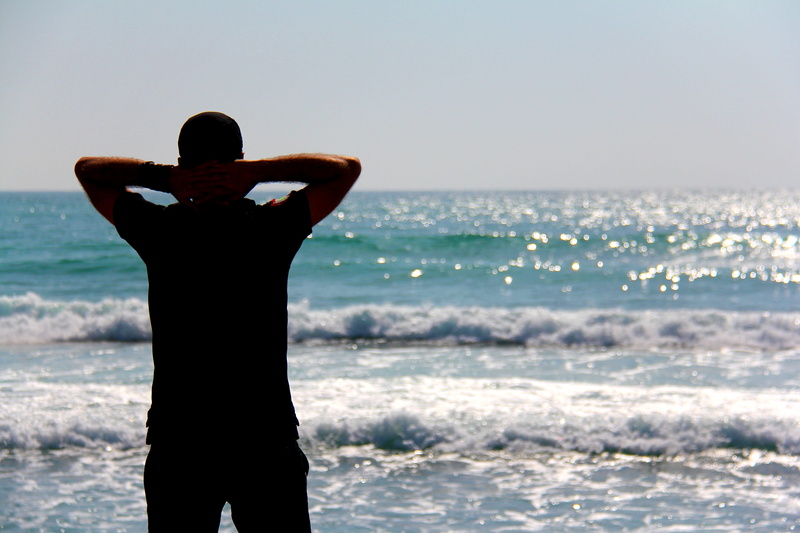 human, sea waves, outdoors, leisure activity, one person, land, horizon over water, lifestyles, adult, horizon, looking at view, apparel, shoreline, waves