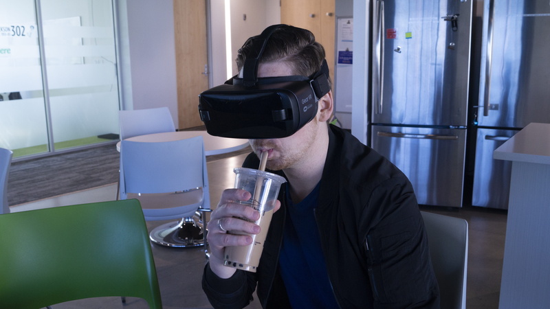 sitting, hmd, cold drink, front view, household equipment, glass, food and drink, drinking, young adult, innovation, oculus, men, indoors, leisure activity