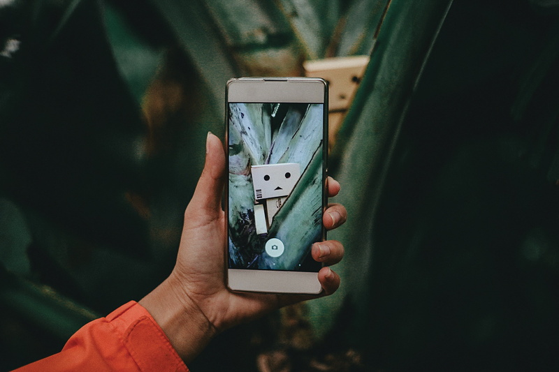 gadget, close-up, photography themes, lifestyles, camera, connection, human body part, liquid-crystal display, smartphone, one person, white, capture, wireless technology