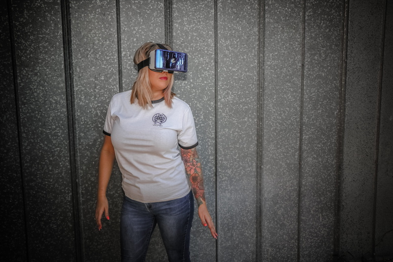 pre-adolescent child, person, three quarter length, innocence, virtual reality goggles, front, standing, males, indoors, tattoos, holding, woman, wall - building feature