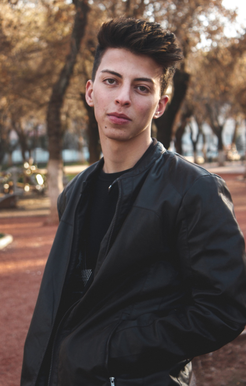 looking, portrait, facial expression, one person, jacket, black, shirt, model, confidence, casual clothing, guy, young men, adult, day, waist up, handsome