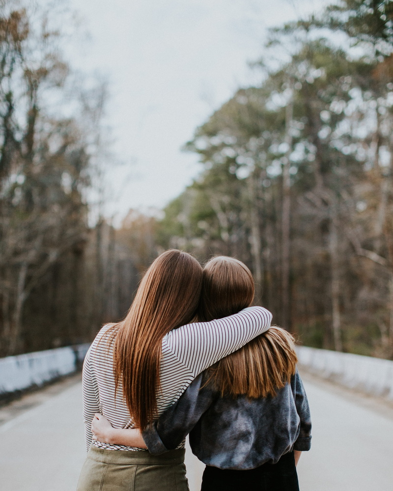 caucasian Ethnicity, walking, outdoors, two, adult, snow, love, shallow focus, smiling, view, couple - relationship, women, embracing, focus, color Image