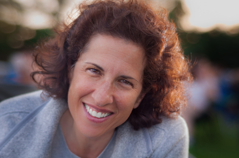 casual Clothing, caucasian Ethnicity, smiling, friendly, human Age, leaning, Bokeh, close up, outdoors, hair, backlit, beautiful woman, front view, image Technique