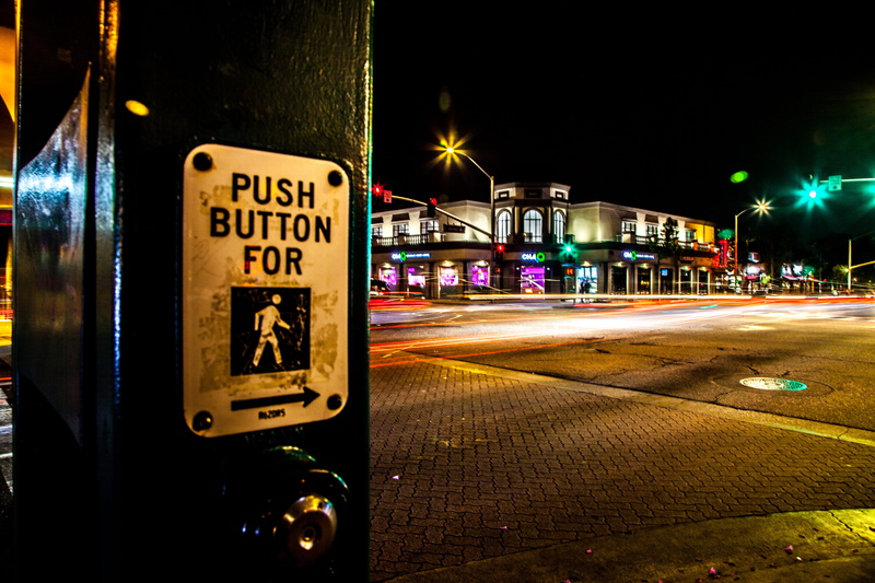 mode of transportation, street, outdoors, western script, city, text, motion, building exterior, architecture, united states, lights, communication, crosswalk