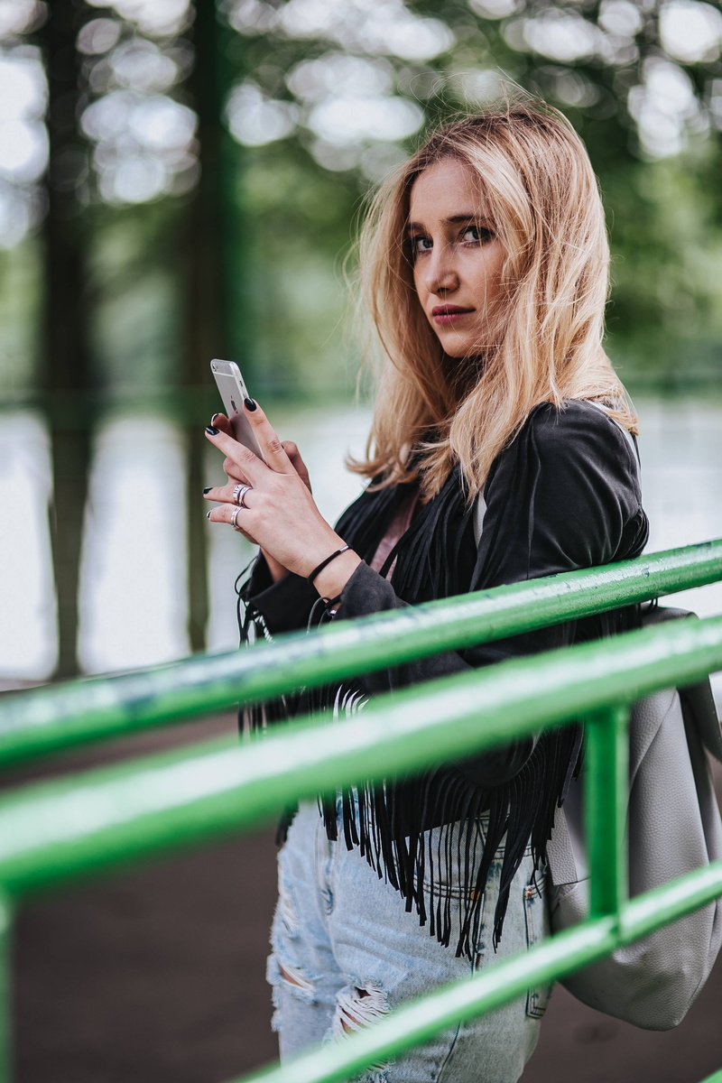 text Messaging, one Person, beautiful, Blonde, smart Phone, ripped, telephone, hairstyle, adult, long Hair, leisure activity, using phone, outdoors, girl