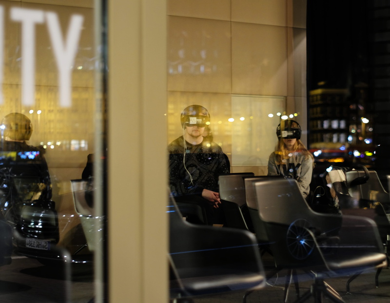 virtualis, window, sitting, indoors, architecture, table, real people, glass - material, chair, night, illuminated, people, virtual reality, reality, adult