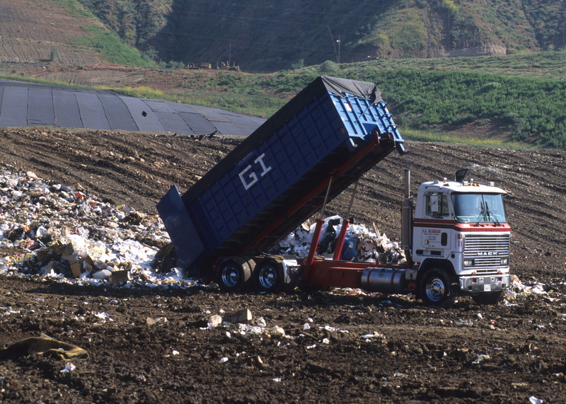 land vehicle, road, field, landscape, daytime, truck, Dump Truck, mode of transportation, mountain, no people, Disposal, white, transportation, pollution