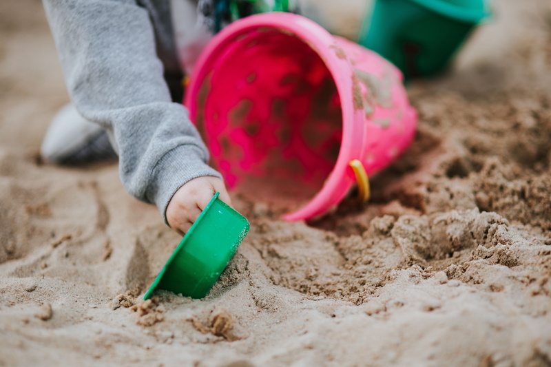 playing, pink color, land, human limb, human hand, gardening, kid, 5K, childhood, jeans, one person, sand, Toddler, rubber boot, people, beach, selective focus