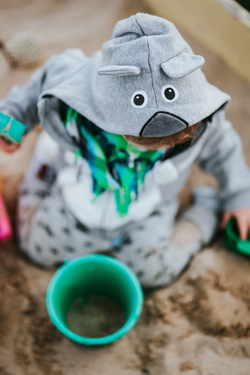 holding, child, representation, innocence, clothing, real people, girls, obscured face, playing, Toddler, high angle view, kid, toy, close-up, indoors
