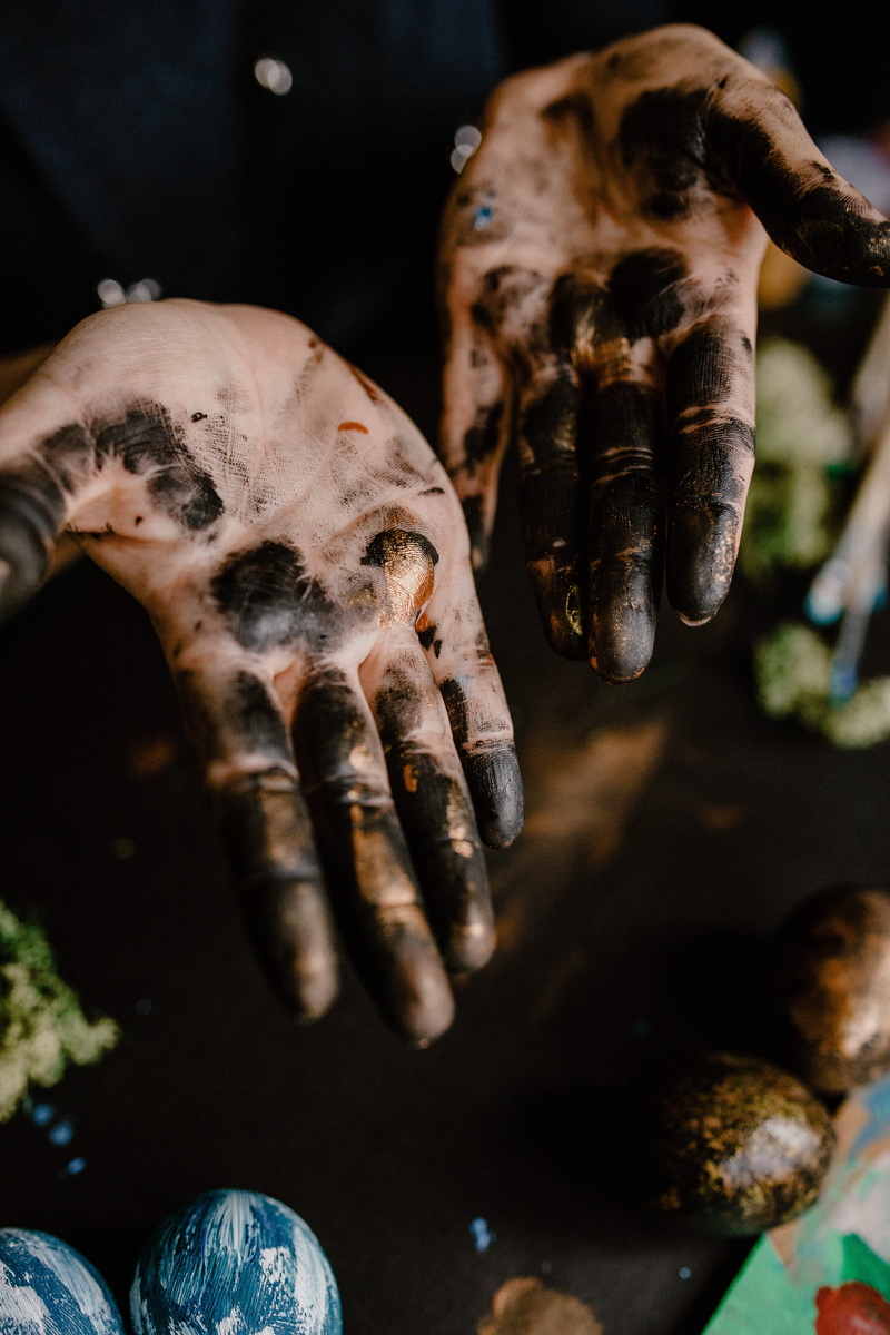 dark, moody, human hand, artist, art, 5K, finger, human finger, holding, close-up, human body part, day, unrecognizable person, paint, focus on foreground