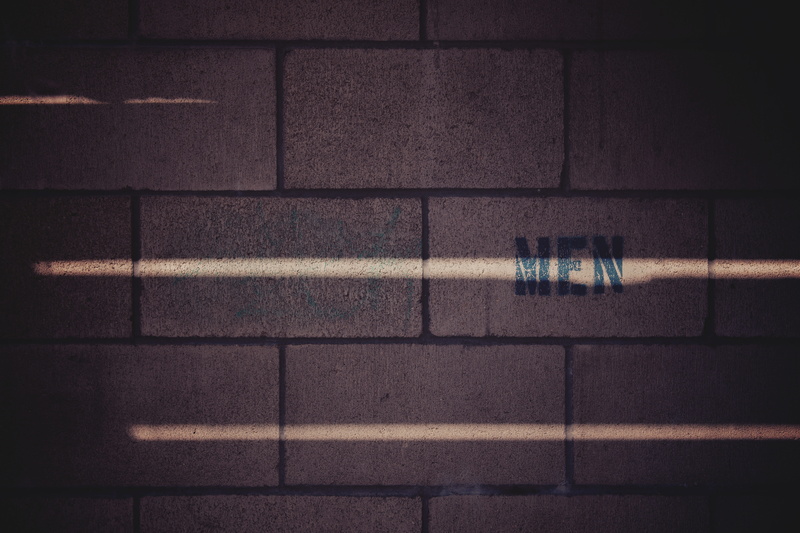 mensroom, dark, material, urban, close-up, brick, black Color, sunlight, man, grey, text, concrete, abstract, sign, bathroom, no People, construction Industry