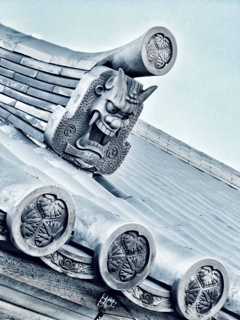 table, indoors, temple, wheel, tradition, closeup, creativity, high angle view, head, art and craft, sky, sculpture, top, close, human representation, day