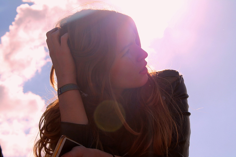 clouds, contemplation, portrait, long hair, one woman only, girl, hairstyle, enjoyment, phone, adult, black, shirt, bracelet, blue, shallow, women, woman