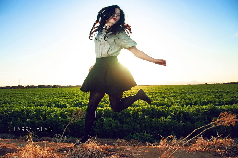 one person, long hair, young adult, young women, lifestyles, freedom, women, brunette, front view, real people, jumping, outdoors, positive emotion, plant