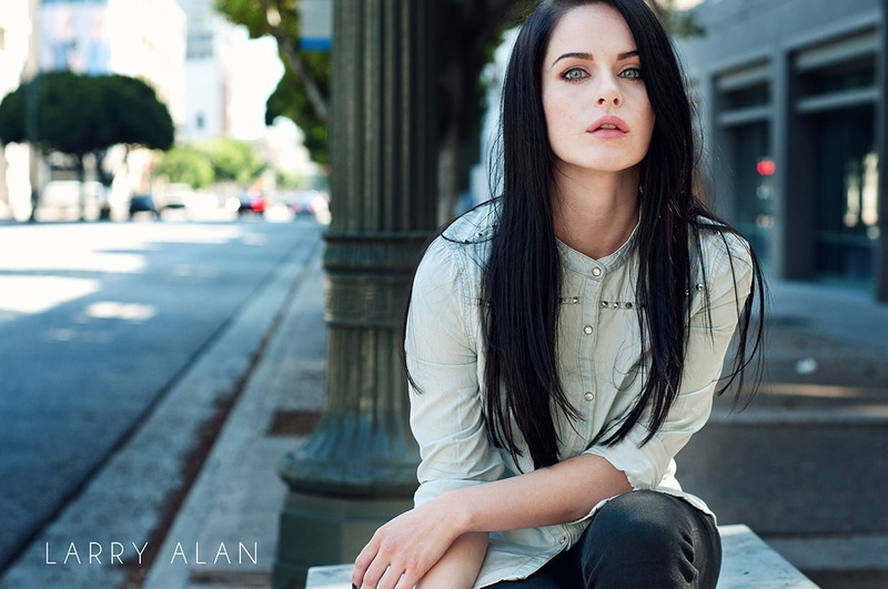 women, long hair, 480P, larry alan, hairstyle, casual clothing, waiting, street, looking at camera, brown hair, city, architecture, beautiful woman, beauty