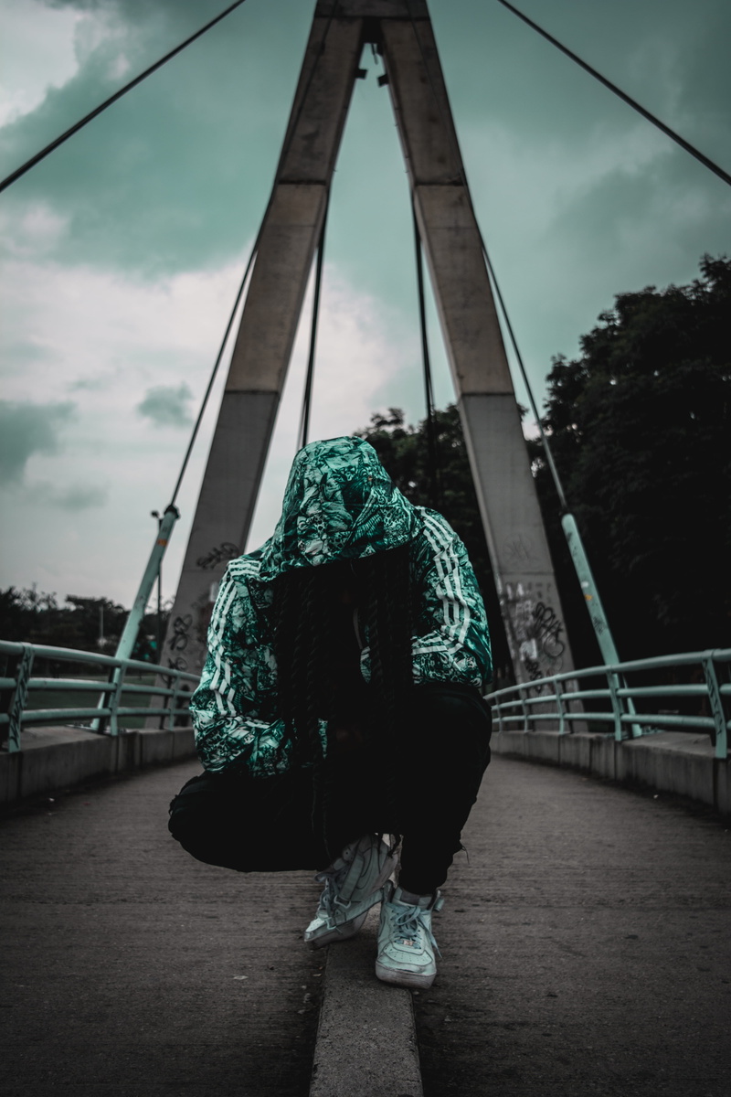 leisure activity, man, crouching, lifestyles, portrait, cloud - sky, bridge, sky, street photography, one person, outdoors, building exterior, urban, white