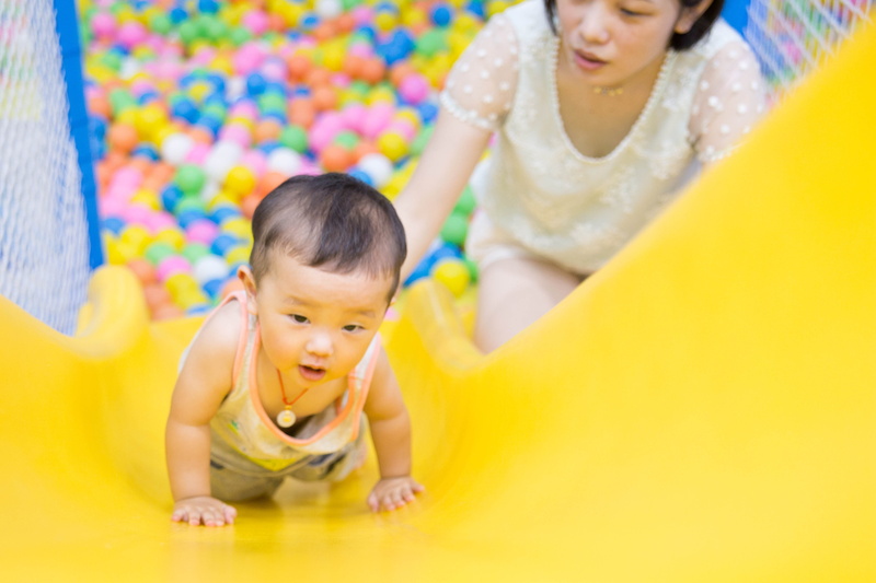 white, crouching, wearing, shirt, indoors, fun, portrait, plastic, childhood, woman, boy, slide, happiness, daughter, smiling, family, parent, adult, game