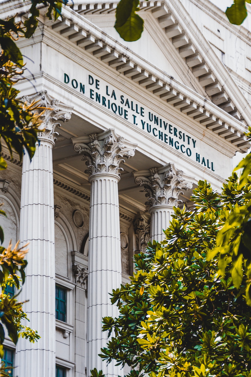 yuchengco hall, angle, photography, column, trees, western script, green, tree, manila, building exterior, white, day, text, low angle view, buildings