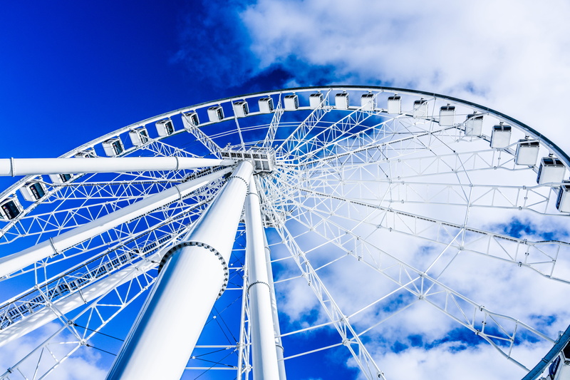 utility pole, blue, wheel, architecture, circle, nature, oilfield, amusement park, geometric shape, fun, arts culture and entertainment, leisure activity