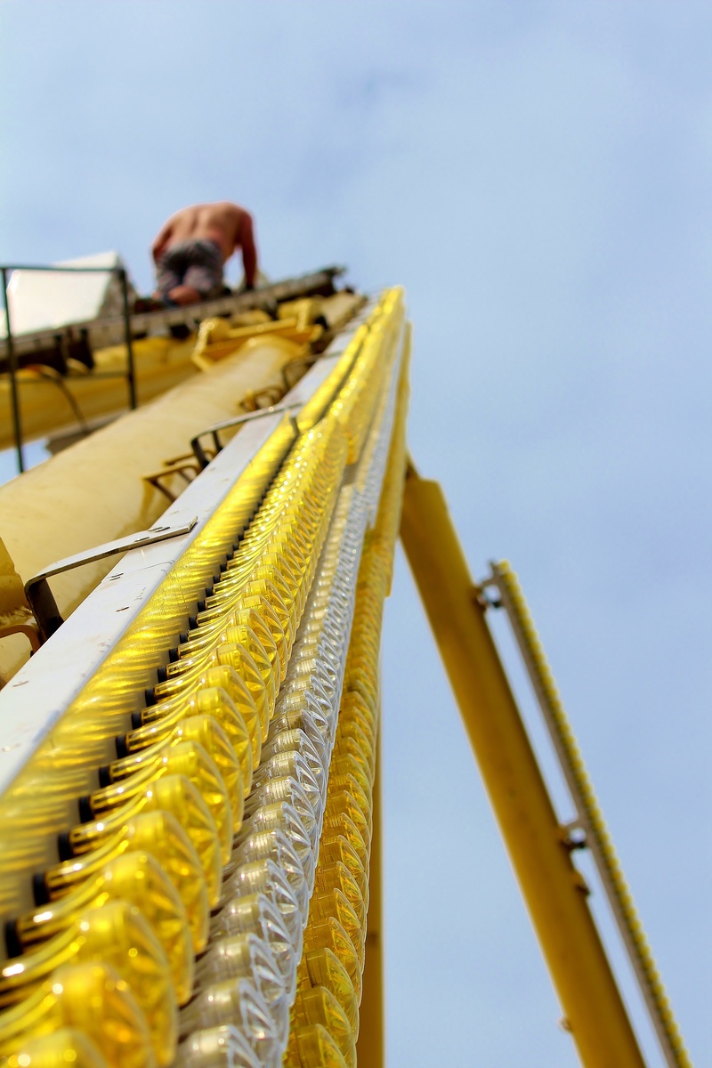 sunlight, nature, selective focus, construction, workers, focus on foreground, carousel, clear sky, yellow, ride, fair, machinery, light, leisure, equipment