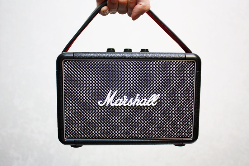 hand, finger, white background, studio shot, western script, one person, guitar, text, technology, real people, equipment, marshall, close-up, electric