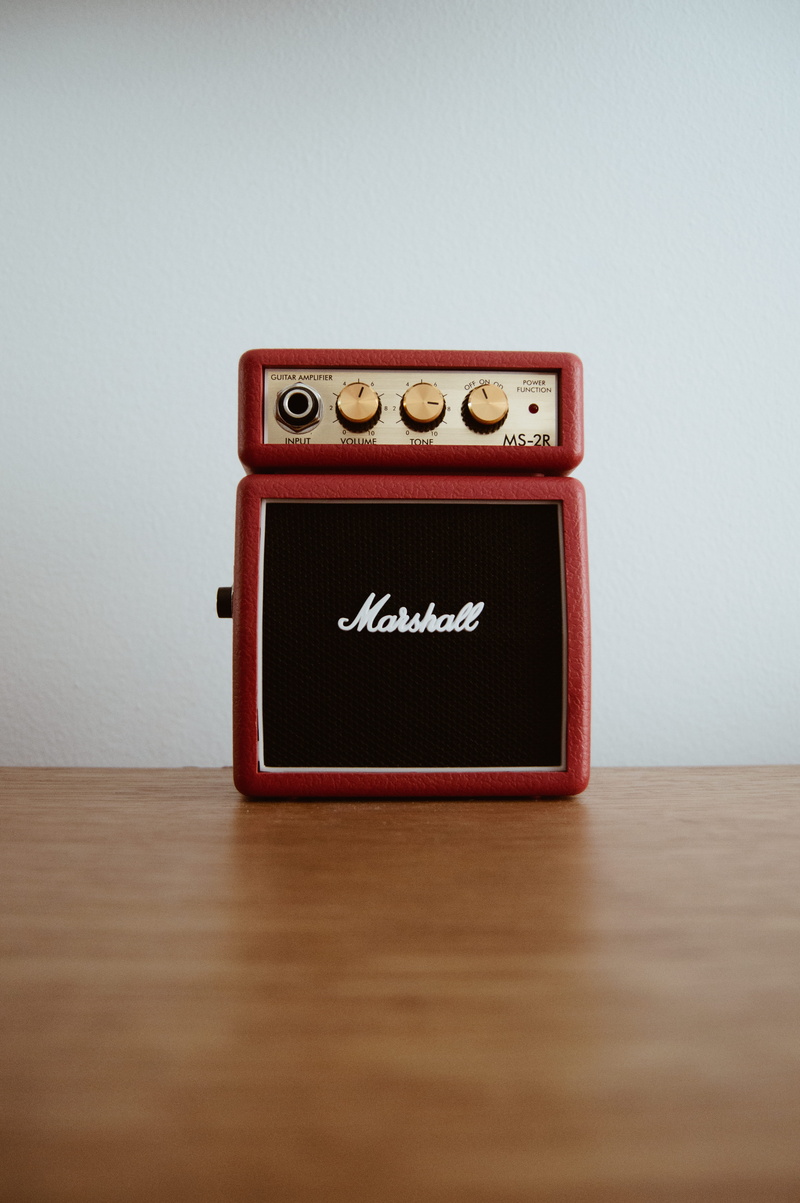 text, single object, indoors, connection, guitar, speaker, no people, vintage, old, radio, still life, brown, antique, copy space, marshal, close-up, table