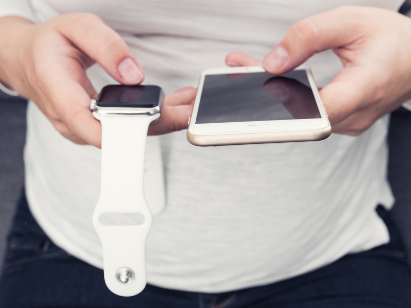 finger, white, focus on foreground, hand, holding, communication, clock, lifestyles, screen, mobile, woman, real people, midsection, mobile phone, iphone
