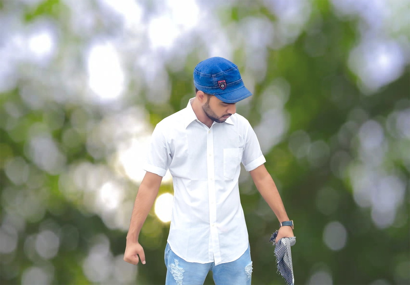 three quarter length, standing, males, casual clothing, cap, day, beard, pre-adolescent child, jeans, outdoors, nature, looking down, leisure activity
