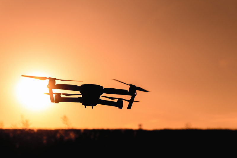 filming, no people, backlit, travel, motion, beauty in nature, mode of transportation, action, aircraft, vehicle, silhouette, evening, sunset, drone, sun