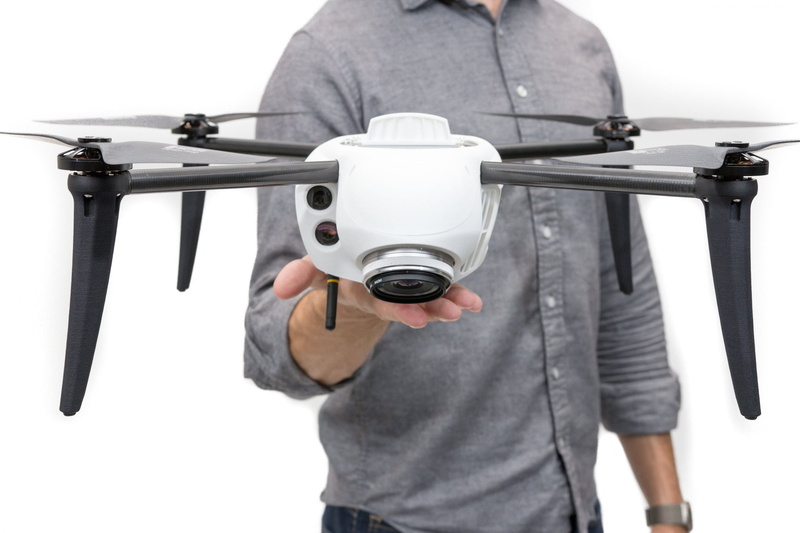 white background, studio shot, best drones, adult, CES 2017, real people, focus on foreground, casual clothing, technology, single object, photography themes