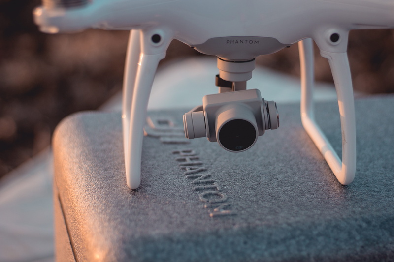 4k, machine part, close-up, gimbal, selective focus, metal, four, shape, summer, dji, still life, camera, machinery, white color, focus on foreground, day
