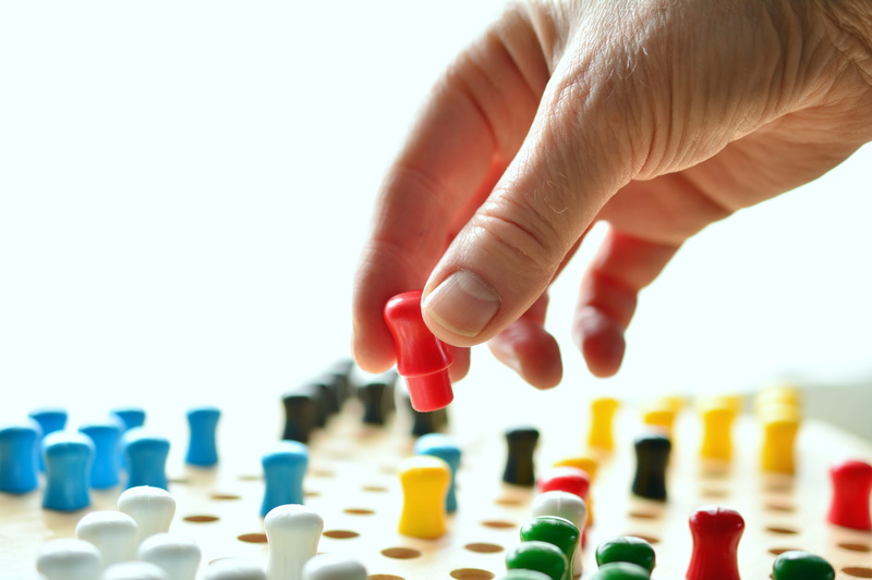 human hand, large group of objects, unrecognizable person, reality, win, hand, holding, location, plan, selective focus, strategy, body part, person, play