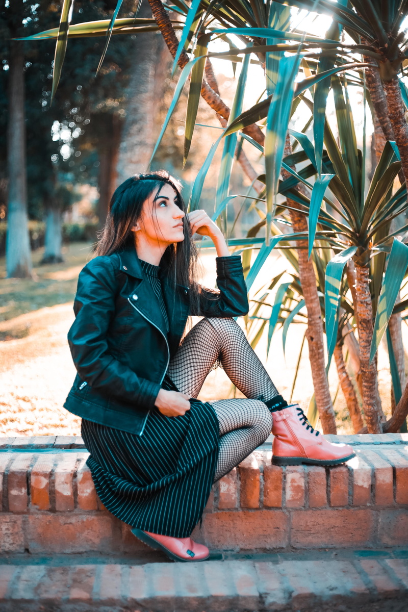 sit, full length, beauty, day, brown, black leather jacket, young women, park, fashion, adult, real people, looking away, photoshoot, facial expression