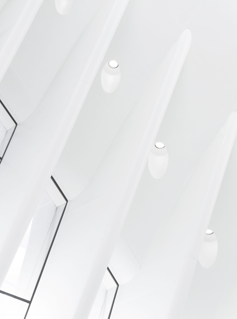 oculus, low angle view, lighting equipment, pattern, day, indoors, simplicity, built structure, illuminated, ceiling, building, landmark, light, architecture