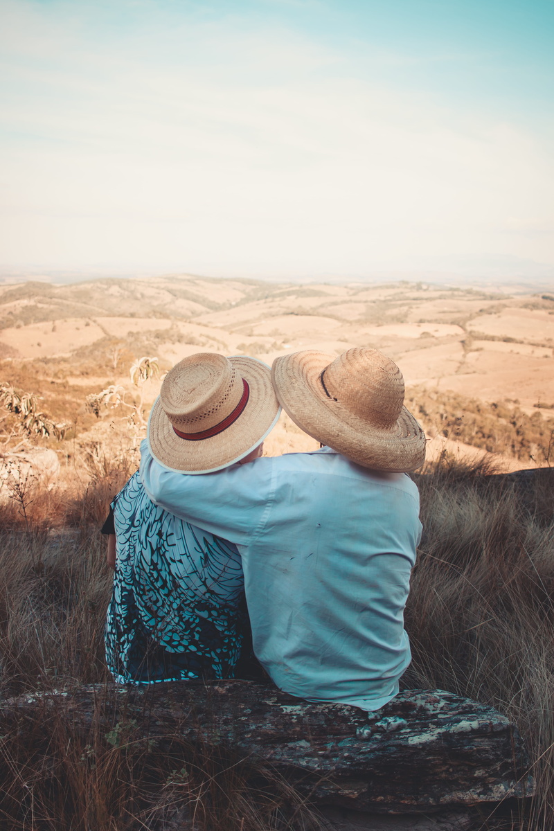 hat, wearing, daylight, nature, love, two, lifestyles, desert, couple, rock, sunhats, landscape, hugging, climate, togetherness, environment, day, women