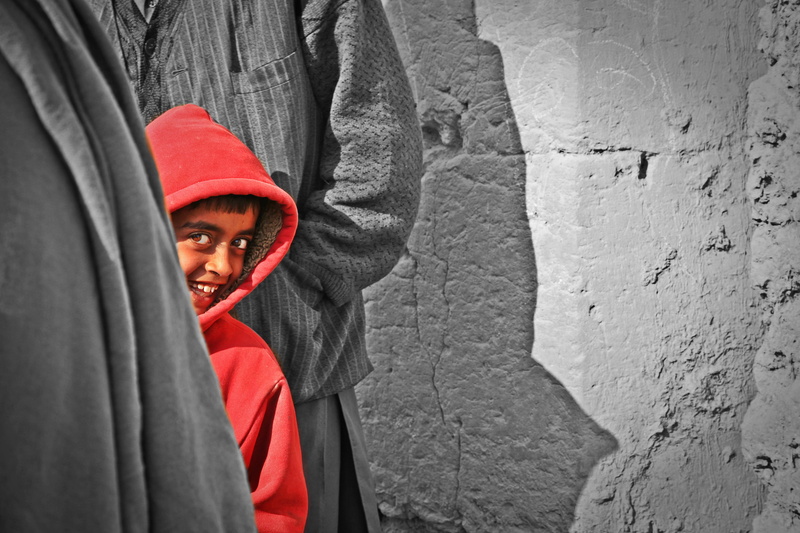 looking at camera, one person, architecture, look, emotion, teen, clothing, hoodie, outdoors, 4K, shadow, youth, smile, portrait, real people, looking