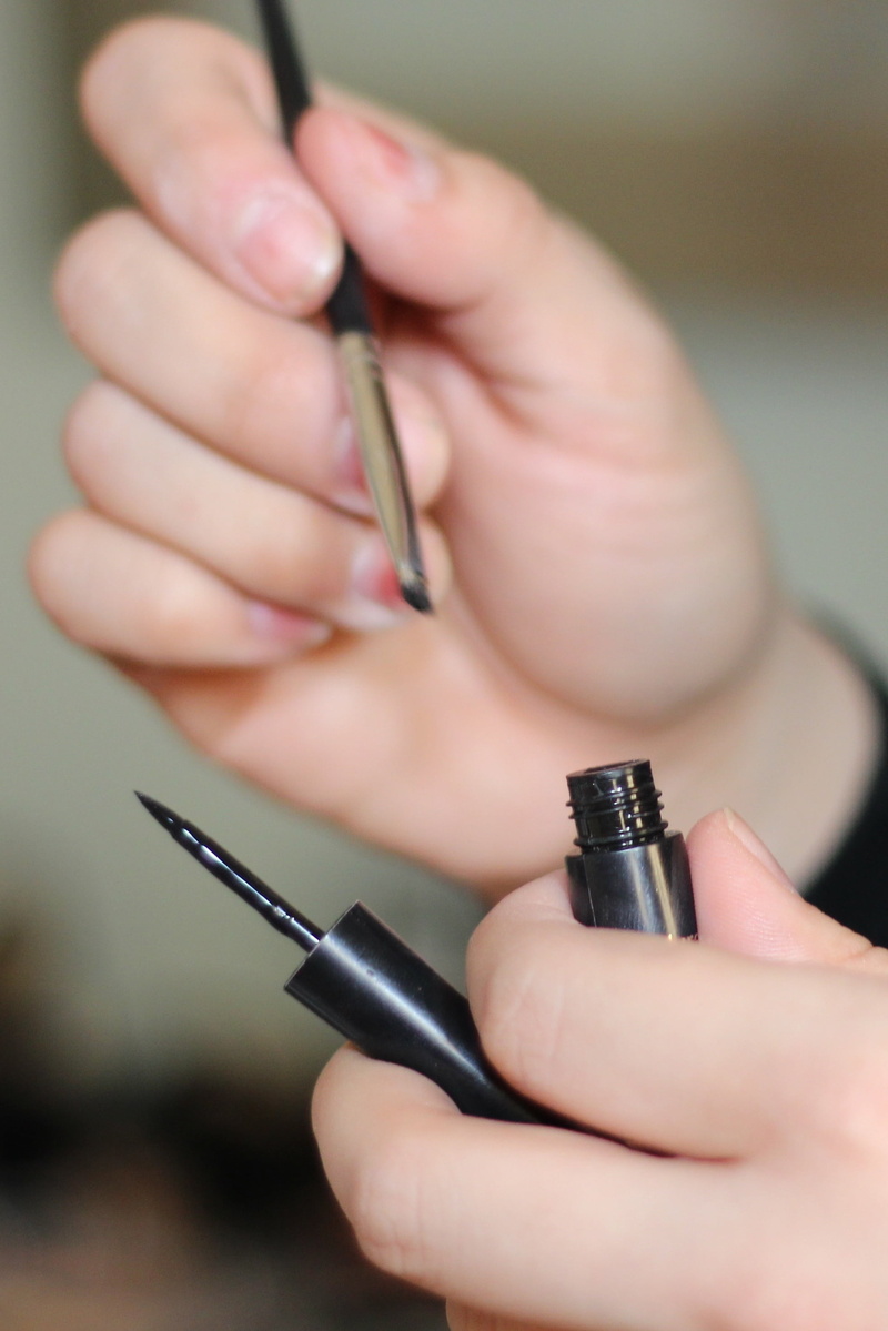 makeup, pen, women, gun, eye, brush, close-up, body part, human hand, human finger, human body part, indoors, real people, focus on foreground, communication