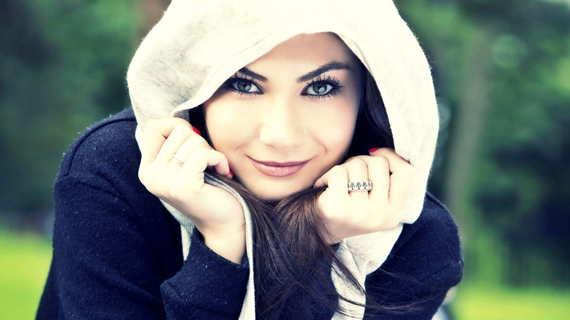 black clothing, hand, red nails, painted nails, close-up, young adult, looking at camera, happiness, smiling, hood, model, adult, scarf, sweater, hands