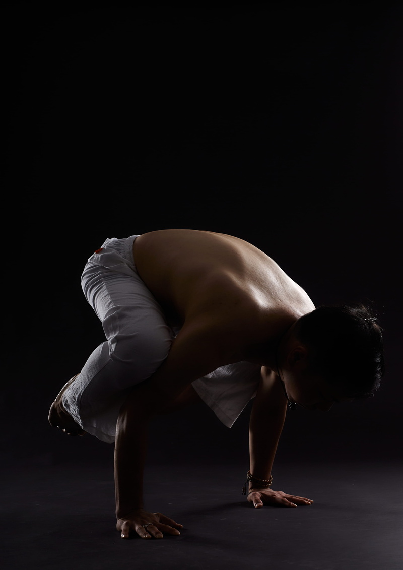 performance, leisure activities, black background, flexibility, bending, bending over, man, athlete, indoors, human, male, strength, young, dancing, gymnist