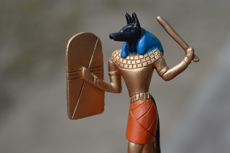 dog head, Ancient Egypt, studio shot, archeology, focus on foreground, representation, brown, craft, human representation, close-up, God, indoors, historic